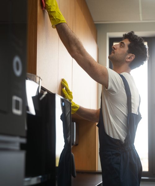 medium-shot-man-cleaning-indoors