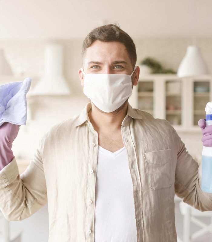 medium-shot-man-with-disinfectant-cloth